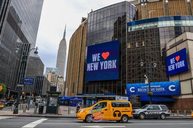 Madison Square Garden, with the Empire State Building in the background, has a panel that says "We Love New York"